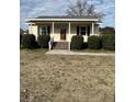 House with front porch and brick steps at 206 Dora Dr, Saint George, SC 29477