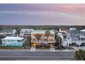 Elevated view of beach home and surrounding neighborhood at 309 Palmetto Blvd, Edisto Island, SC 29438