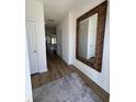 Bright entryway with hardwood floors, a large mirror, and access to other rooms at 413 Trotters Ln, Moncks Corner, SC 29461