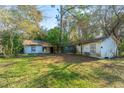 Overgrown backyard with two small structures needing renovation at 4230 Barnwell Ave, North Charleston, SC 29405