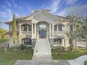 Elegant home featuring a grand entrance and manicured landscaping at 6411 China Back Ln, Meggett, SC 29449