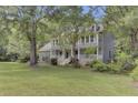 Two story house with wrap around porch and large yard at 820 Pineneedle Way, Charleston, SC 29492