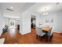 Dining room with hardwood floors and view of kitchen at 9159 Parlor Dr, Ladson, SC 29456