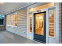Inviting front door entrance with glass panel and hardwood flooring at 929 Rutledge Ave, Charleston, SC 29403