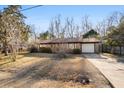 Ranch house with a driveway and mature trees at 116 Eagle Dr, Summerville, SC 29485
