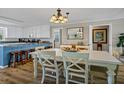 Bright dining area with white table and chairs at 1308 Palmetto Blvd Blvd, Edisto Beach, SC 29438