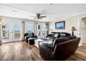 Relaxing living room with ocean views and leather furniture at 1308 Palmetto Blvd Blvd, Edisto Beach, SC 29438