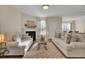 Spacious living room with hardwood floors, fireplace, and neutral-toned furniture at 153 Instructor Ct, Ladson, SC 29456