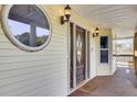 Elegant front door with sidelights and circular window at 1661 Battalion Dr, Charleston, SC 29412