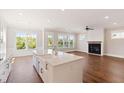 Spacious living area featuring hardwood floors and a fireplace at 1892 Grover Rd, Johns Island, SC 29455