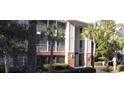 Brick building with screened porches and palm trees at 1908 Basildon Rd, Mount Pleasant, SC 29466