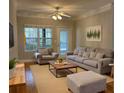 Spacious living room with hardwood floors and comfy furniture at 1908 Basildon Rd, Mount Pleasant, SC 29466