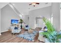 Bright living room featuring hardwood floors and a vaulted ceiling at 226 Comiskey Park Cir, Summerville, SC 29485