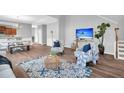 Spacious living room with hardwood floors and comfy seating at 226 Comiskey Park Cir, Summerville, SC 29485