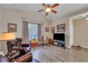 Living room with hardwood floors, a fireplace, and a TV at 329 Flyway Rd, Goose Creek, SC 29445