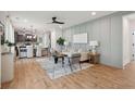 Open-concept living area with hardwood floors, a neutral color palette and stylish furnishings at 457 Eagleview Dr, Moncks Corner, SC 29461