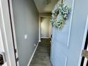 Gray hallway with light gray walls, and wood-look flooring at 515 Purple Finch Rd, Summerville, SC 29486