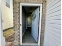Open blue front door with a wreath, leading into a gray hallway at 515 Purple Finch Rd, Summerville, SC 29486