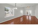 Sun-drenched dining room with hardwood floors and French doors to the patio at 5211 Fernland Way, North Charleston, SC 29420