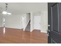 Bright and airy entryway with hardwood floors and staircase at 5211 Fernland Way, North Charleston, SC 29420