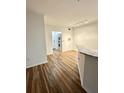 Open living area with wood-look floors and kitchen access at 60 Fenwick Hall Aly # 313, Johns Island, SC 29455