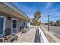 Relaxing deck with rocking chairs, overlooking the street at 609 Palmetto Blvd, Edisto Beach, SC 29438
