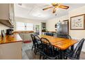 Bright kitchen with ample counter space and a farmhouse table at 609 Palmetto Blvd, Edisto Beach, SC 29438