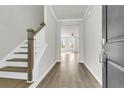 Bright entryway with hardwood floors and staircase at 733 Opal Wing St, Moncks Corner, SC 29461