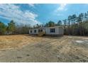 Newly built manufactured home on a large lot, surrounded by trees at 857 Devines Way, Cross, SC 29436