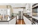 Spacious kitchen with white cabinets, granite countertops, and stainless steel appliances at 102 Black Stilt Way, Summerville, SC 29483