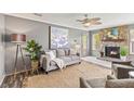 Cozy living room with stone fireplace, grey walls and comfy seating at 109 Salem Ct, Summerville, SC 29486