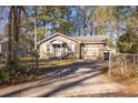 Brick ranch house with attached garage and a spacious yard at 1134 S Shadow Dr, Mount Pleasant, SC 29464
