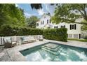 Relaxing pool area with patio furniture and lush greenery at 124 Mary St, Mount Pleasant, SC 29464