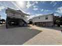 Two story beach house with parking and separate guest quarters at 1306 Palmetto Blvd, Edisto Beach, SC 29438