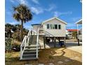 Cute beach cottage with private balcony and stairs at 1306 Palmetto Blvd, Edisto Beach, SC 29438