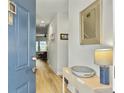 Bright entryway with light wood flooring and a view into the living room at 1448 Thin Pine Dr, Johns Island, SC 29455