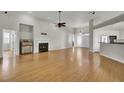 Open living room featuring hardwood floors and a fireplace at 1857 Palmetto Isle Dr, Mount Pleasant, SC 29466