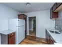 Kitchen boasts dark wood cabinets and quartz countertops at 2749 E Surrey Dr, North Charleston, SC 29405