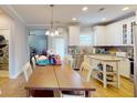 Modern kitchen with white cabinets and kitchen island at 3419 Fairwater Pl, Mount Pleasant, SC 29466