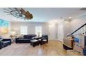 Spacious living room with leather furniture and fireplace at 3419 Fairwater Pl, Mount Pleasant, SC 29466