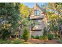 Tan house with mature trees and landscaping at 515 Claret Way, Kiawah Island, SC 29455