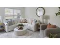 Cozy living room featuring a white sofa and accent chair at 519 Parkdale Dr # J, Charleston, SC 29414