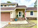 Front entrance with brick steps, a door, and American flag at 8025 Eberly Ave, North Charleston, SC 29420