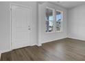 Living room with hardwood floors and large windows at 107 Pen Shell St, Summerville, SC 29485