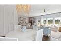Open concept dining room with chandelier, adjacent to kitchen and living room at 110 Threaded Fern St, Summerville, SC 29485