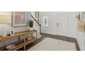 Bright and airy entryway with wood floors and a stylish console table at 110 Threaded Fern St, Summerville, SC 29485