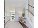 Light-filled entryway, showcasing wood floors and a view to the living area at 110 Threaded Fern St, Summerville, SC 29485