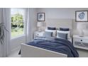 Bright bedroom with a blue comforter and plenty of natural light at 114 Threaded Fern St, Summerville, SC 29485