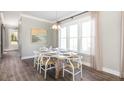 Bright dining room with hardwood floors and large windows at 1443 Clay Field Trl, Summerville, SC 29485