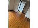 Hardwood floor living room with an open door to the entryway at 1972 Green Park Ave, Charleston, SC 29414